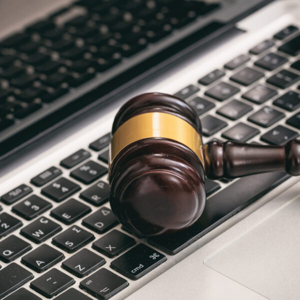 Online auction concept. Auction or judge gavel on a computer keyboard
